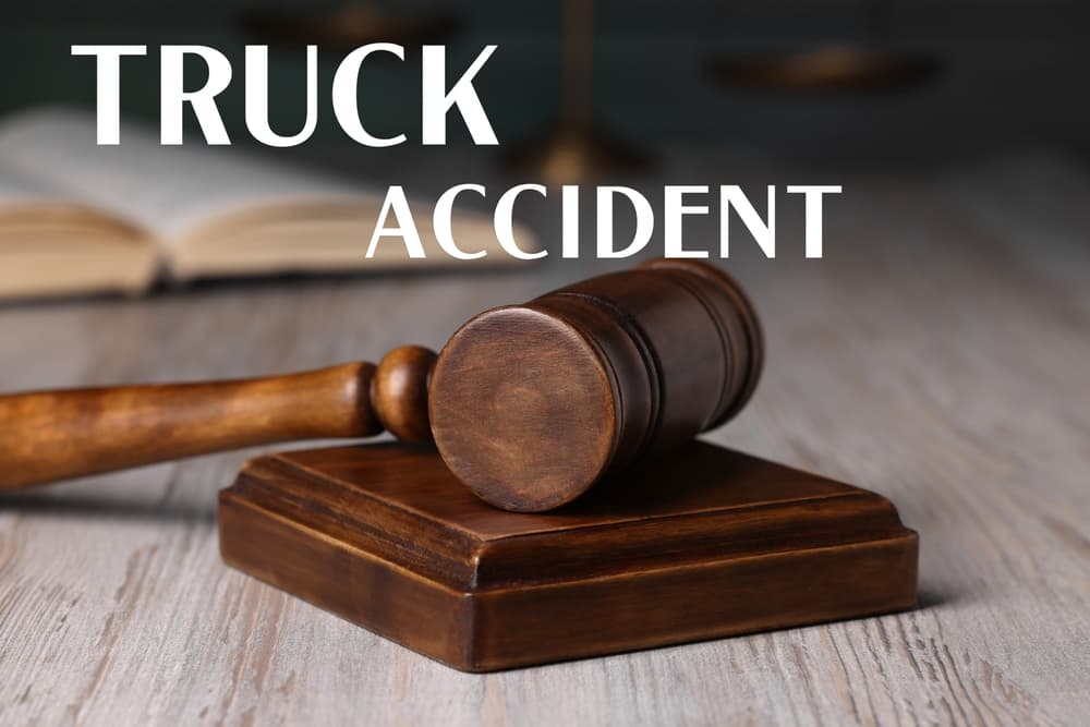 Truck accident law with a judge's gavel resting on a wooden table.