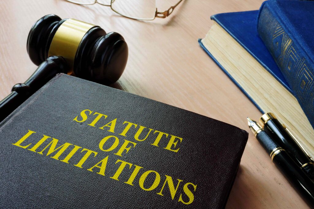 Statute of limitations law book with judge’s gavel, legal books, and pen on desk, representing legal deadlines and filing time limits Statute of limitations law book with judge’s gavel, legal books, and pen on desk, representing legal deadlines and filing time limits
